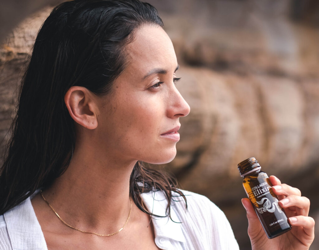 Woman drinking Collagen Elixir